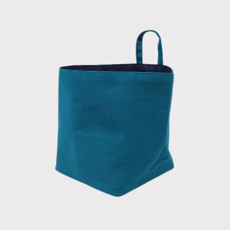 Niky türkiz textil tárolókosár – modern, kompakt rendszerező otthonra.